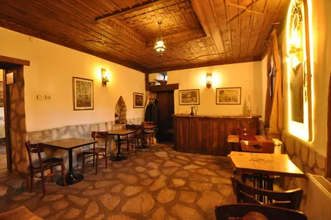 Shared sitting area beneath a wooden ceiling