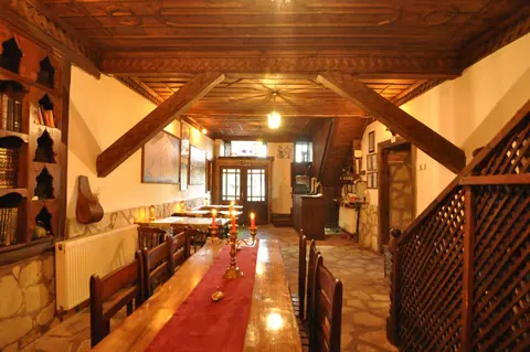 Long wooden table and shelves in a shared area