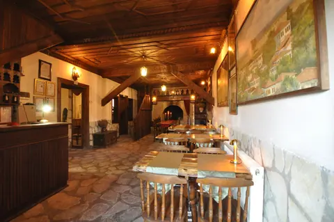 Tables in the shared area with a stone floor