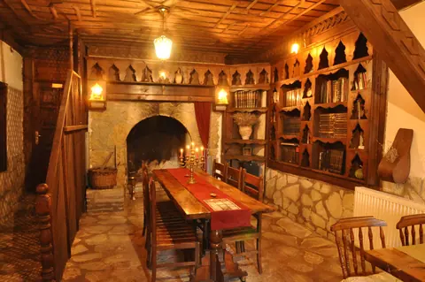 Shared interior with a stone hearth and wooden details