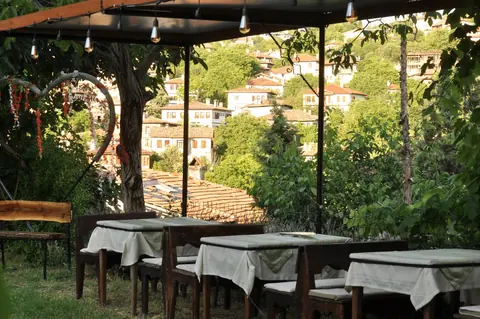 Garden tables beneath the trees