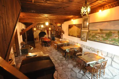 Shared lounge with a wooden ceiling and stone floor